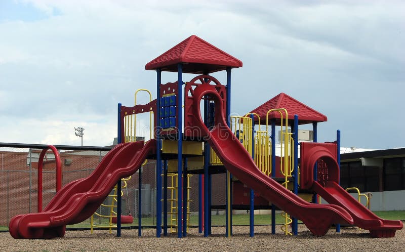 Contemporary playground equipment on school grounds. Contemporary playground equipment on school grounds.