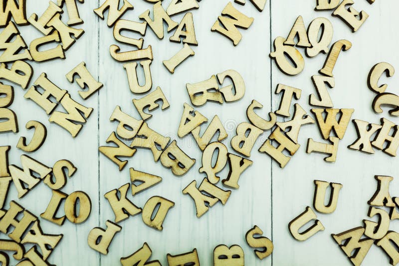 Spilled wooden letters on a white wooden background royalty free stock photos Spilled wooden letters on a white wooden background royalty free stock photos