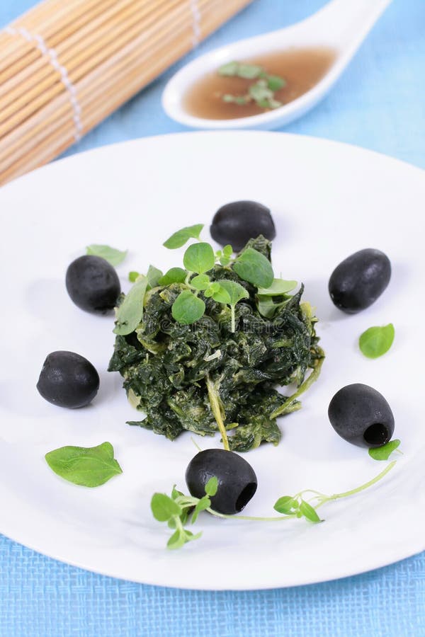 Spinach with black olives