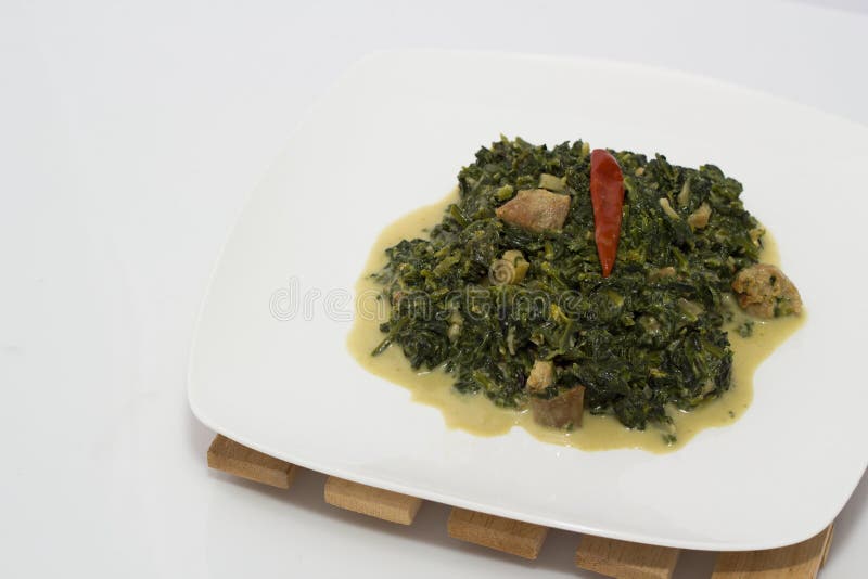 Spinach with coconut milk stock image. Image of wood 46895033