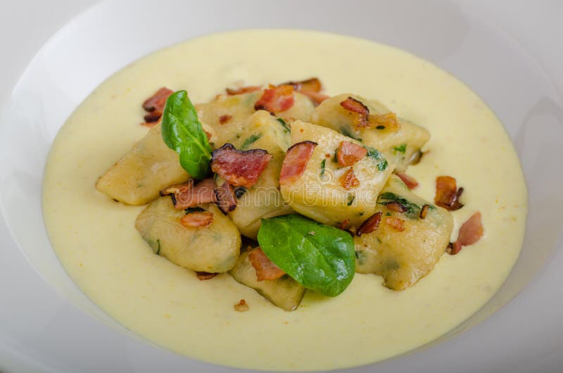 Spinach Gnocchi with Parmesan Sauce Topped with Bacon Stock Photo ... Spinach Gnocchi with Parmesan Sauce Topped with Bacon Stock Photo ...