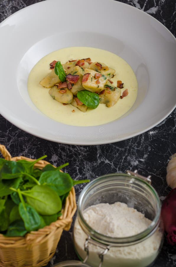 Spinach Gnocchi with Parmesan Sauce Topped with Bacon Stock Photo ... Spinach Gnocchi with Parmesan Sauce Topped with Bacon Stock Photo ...