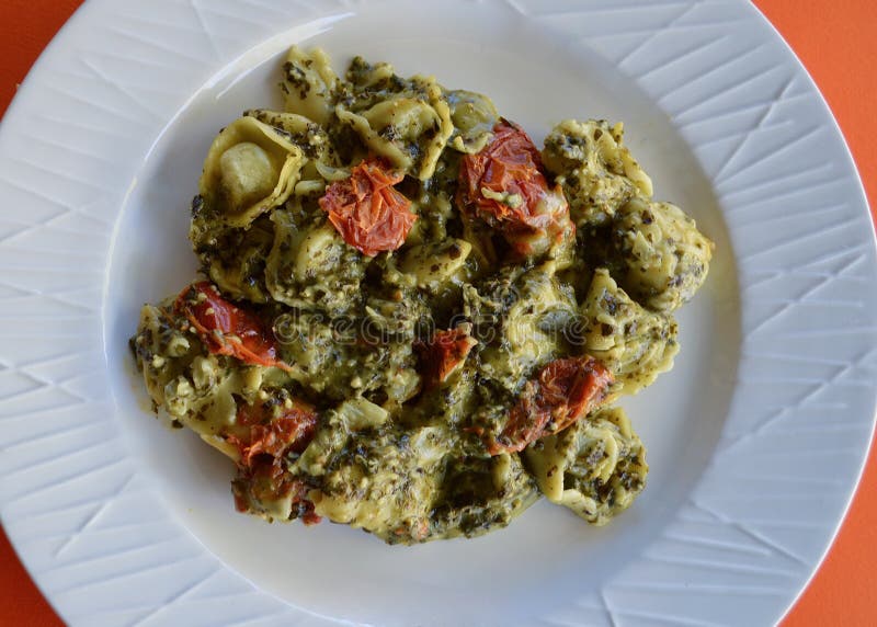 Spinach and Ricotta Tortellini on a Plate Stock Image - Image of basil
