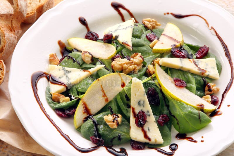 Spinach Salad with Pear, Walnuts and Blue Cheese Stock Photo - Image of