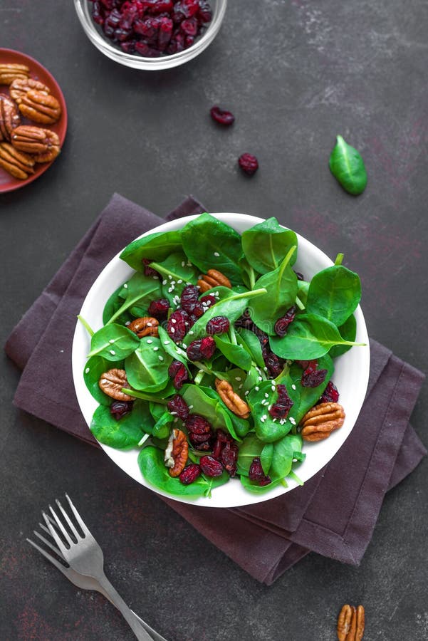 Spinach Salad With Pecan Nuts And Cranberries Stock Photo - Image of ...