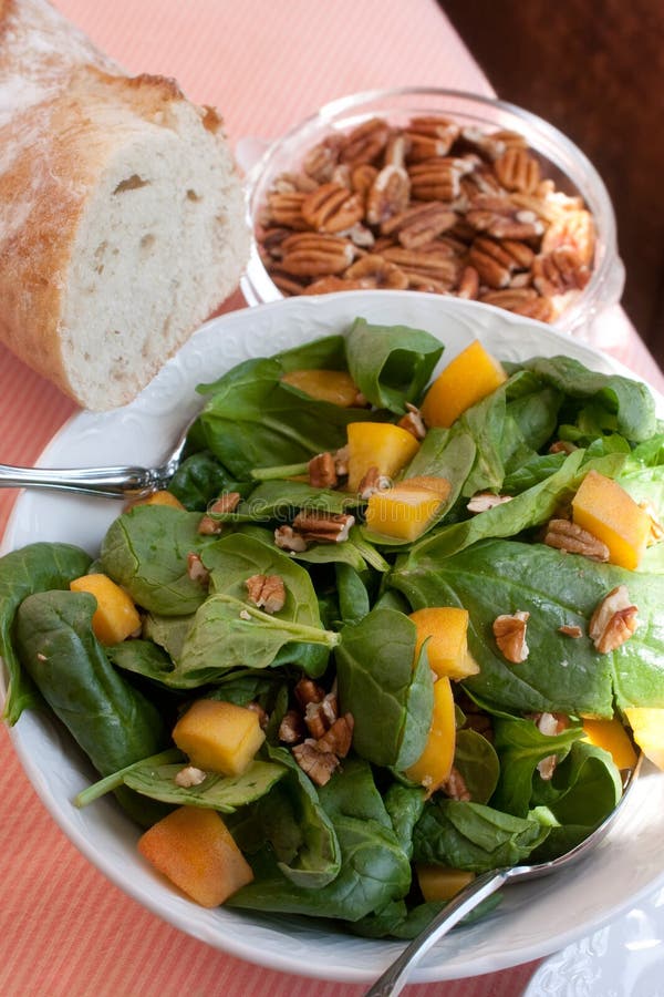 Spinach Salad with Pecans, Peaches and Fresh Bread Stock Photo Image
