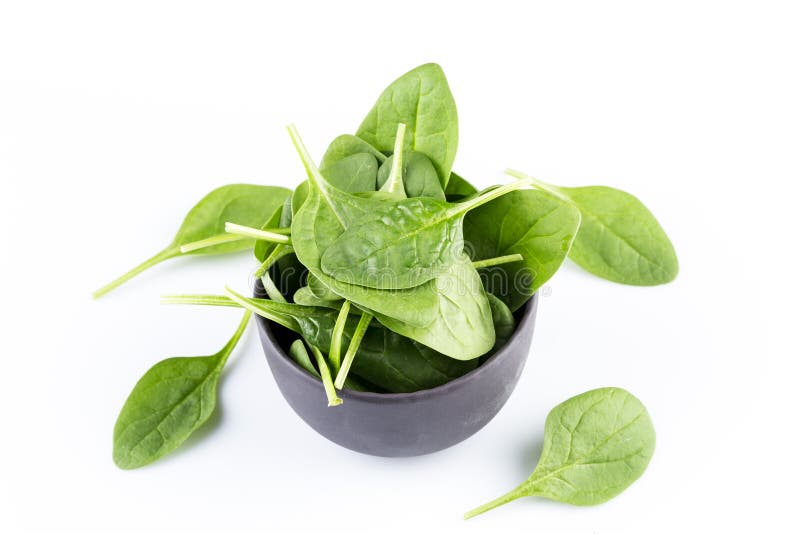 Spinaci verdi su un fondo bianco fotografia stock libera da diritti Spinaci verdi su un fondo bianco fotografia stock libera da diritti