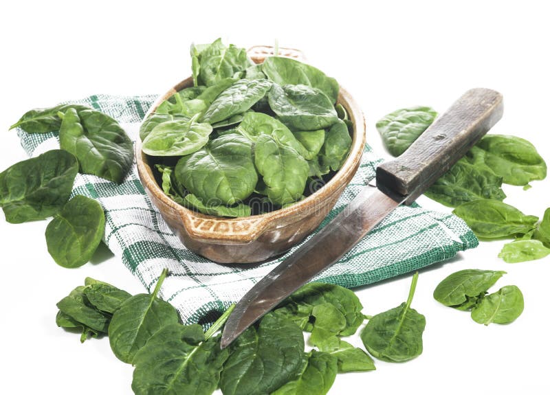 Green spinach in a bowl on a white background. Green spinach in a bowl on a white background