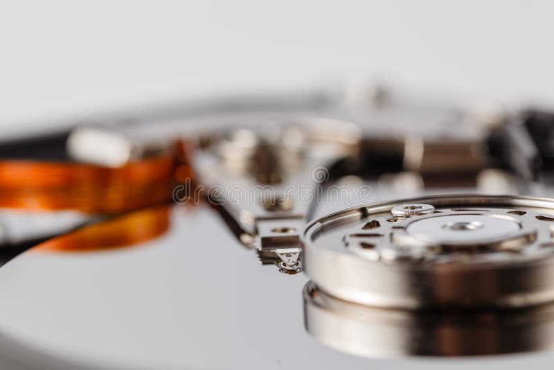 Spindle with Plate and Actuator Arm Opened Hard Disk Drive HDD. Macro