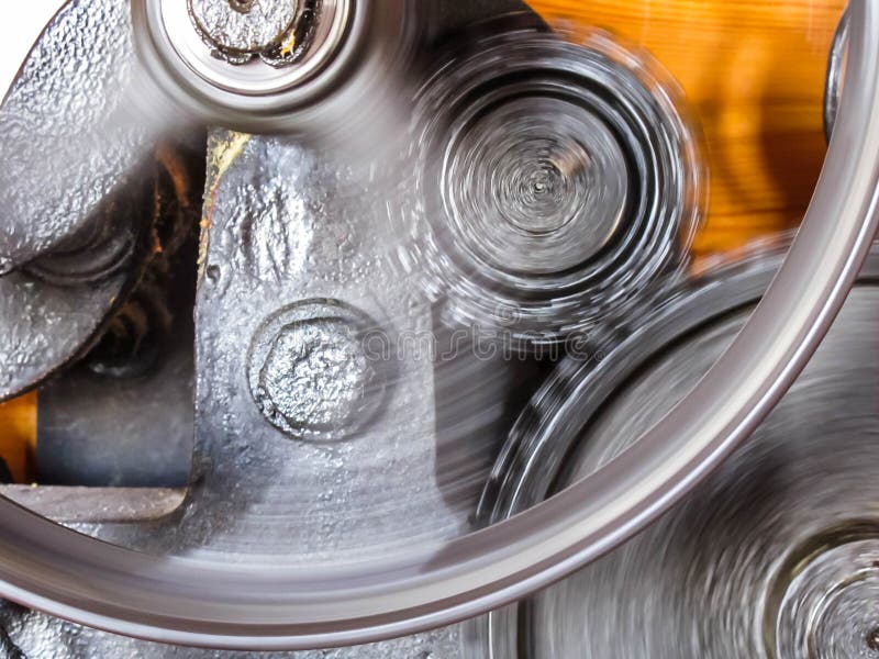 Fast spinning cog wheels inside a water mill