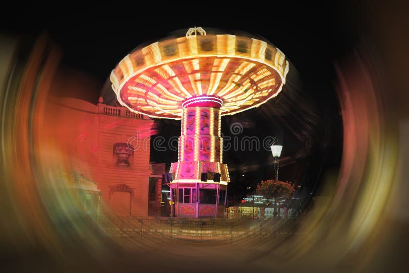 Spinning swings at night