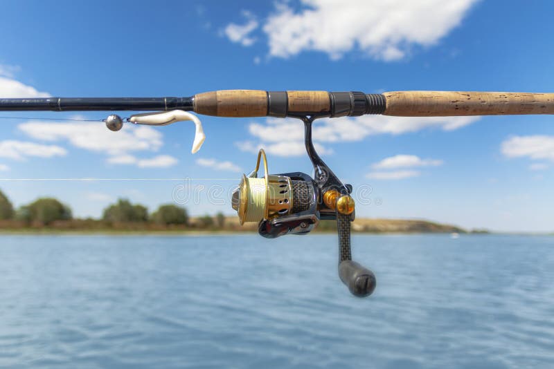 Spinning Tackle Against the Background of the River Stock Photo Image
