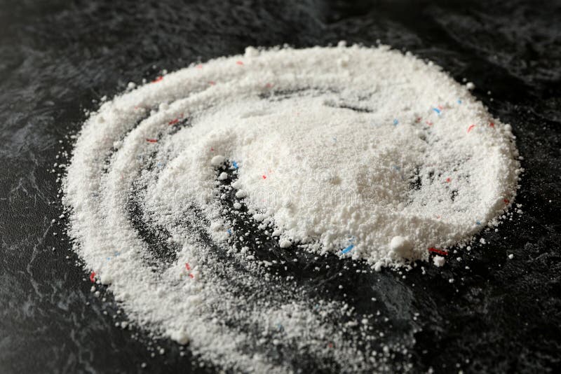 Spiral made of washing powder on black smokey background royalty free stock photography