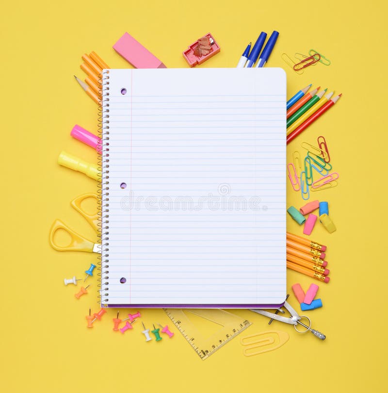 Notepad spiral with pencils and sketchbook on table · Free Stock Photo