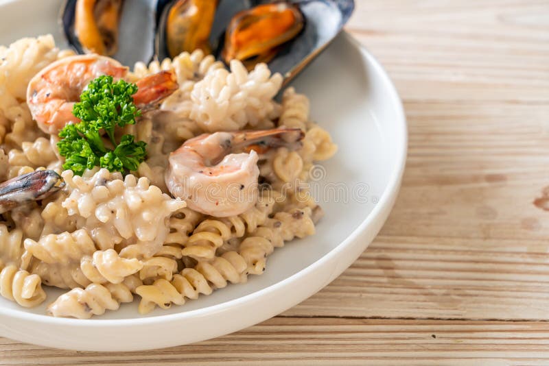 Spiral Pasta Mushroom Cream Sauce with Seafood Stock Photo - Image of
