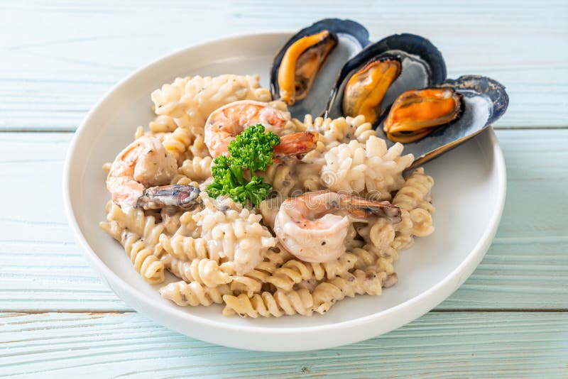 Spiral Pasta Mushroom Cream Sauce with Seafood Stock Image - Image of