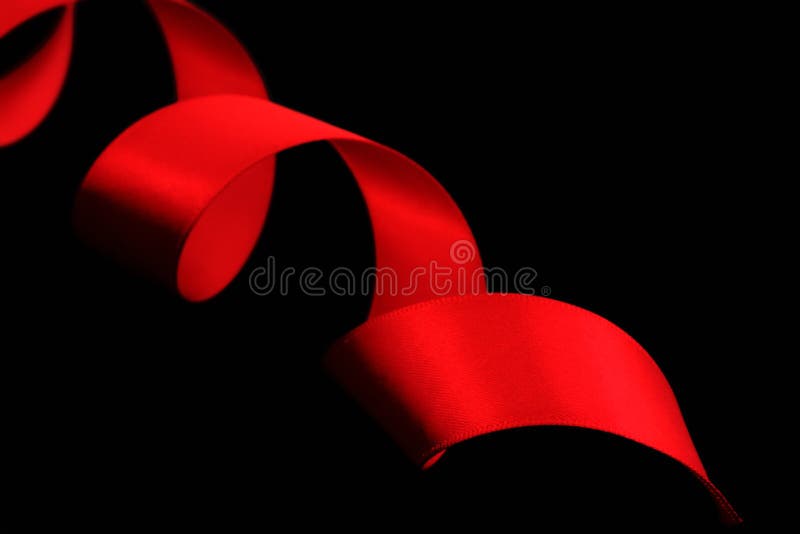 Spiral of Red Satin Ribbon stock image