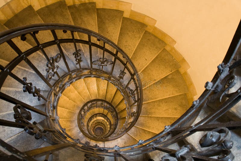 Spiral staircase and stone steps in old tower