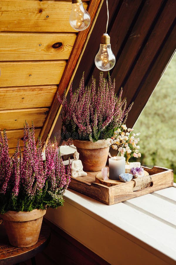 Spiritual Home Balcony Decor with Heather Flowers, Candlelight Flame,  Crystal Geodes, Crystal Wire Tree and Small Buddha Figurine. Stock Image -  Image of boho, cluster: 230352973