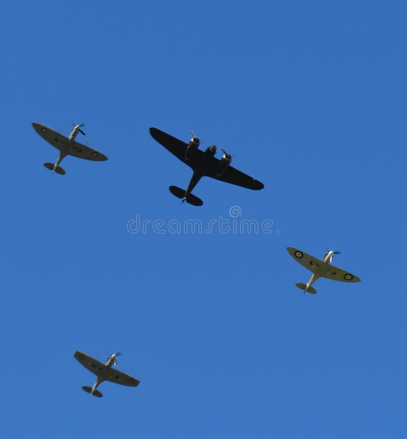 Spitfire aircraft flying in formation over Southern England with a single Bristol Blenheim bomber. royalty free stock photography