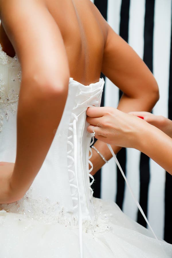 Lace bridal corset. View from the back of the bride. Lace bridal corset. View from the back of the bride