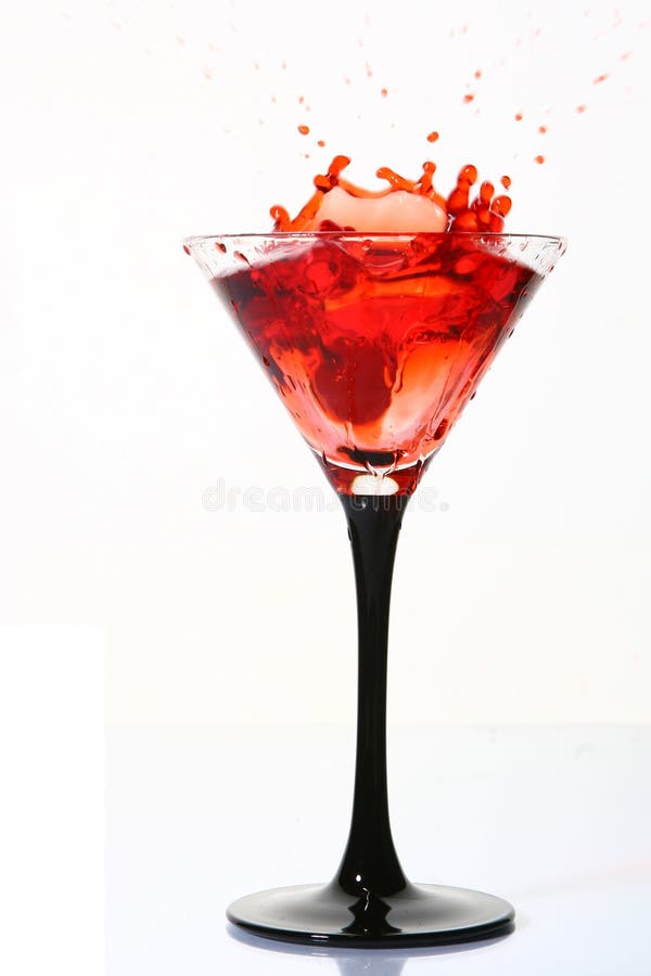 Splash cocktail with dessert cherry