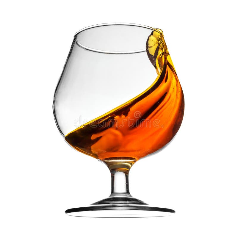 Splash of cognac in glass on white background