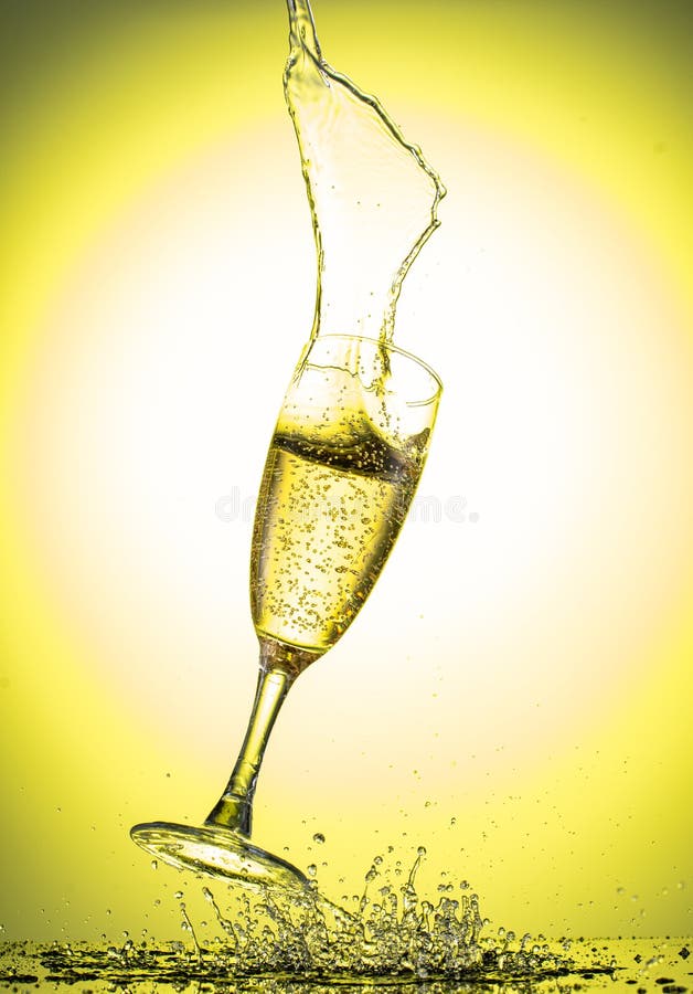 Splash in a Falling Champagne Glass on a Color Yellow Gradient