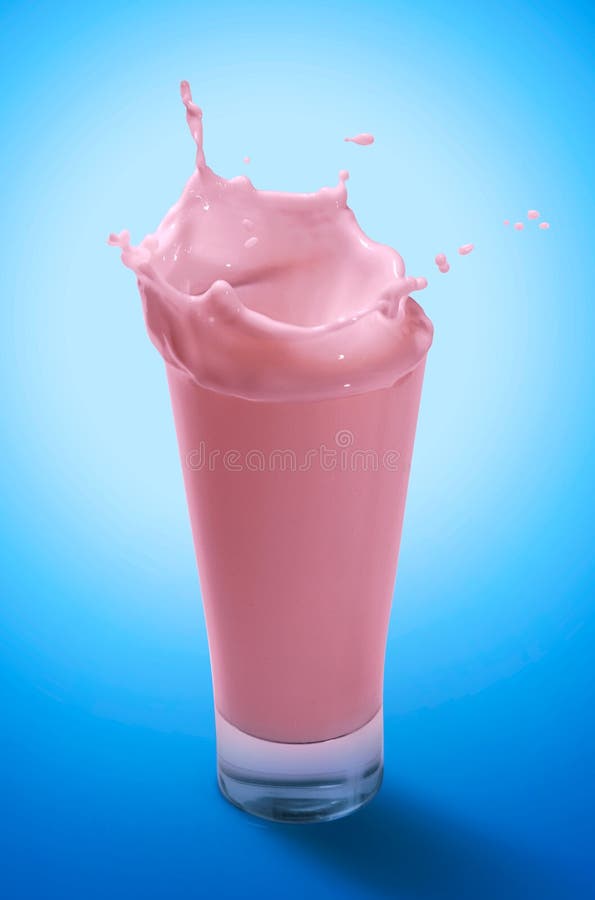 Splash of Strawberry Milkshake in A Glass stock photo Splash of Strawberry Milkshake in A Glass stock photo