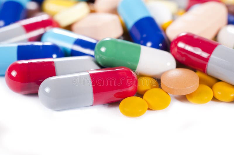 Splashed capsulas royalty free stock photos