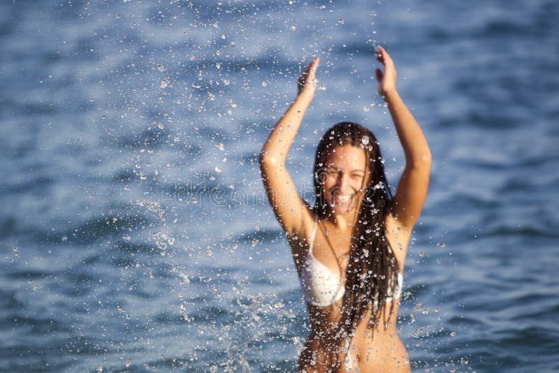Splashing on the beach royalty free stock images
