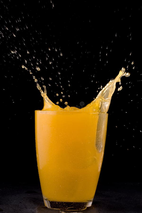 Glass Of Splashing Mango Juice Stock Photo Image of drop, splash