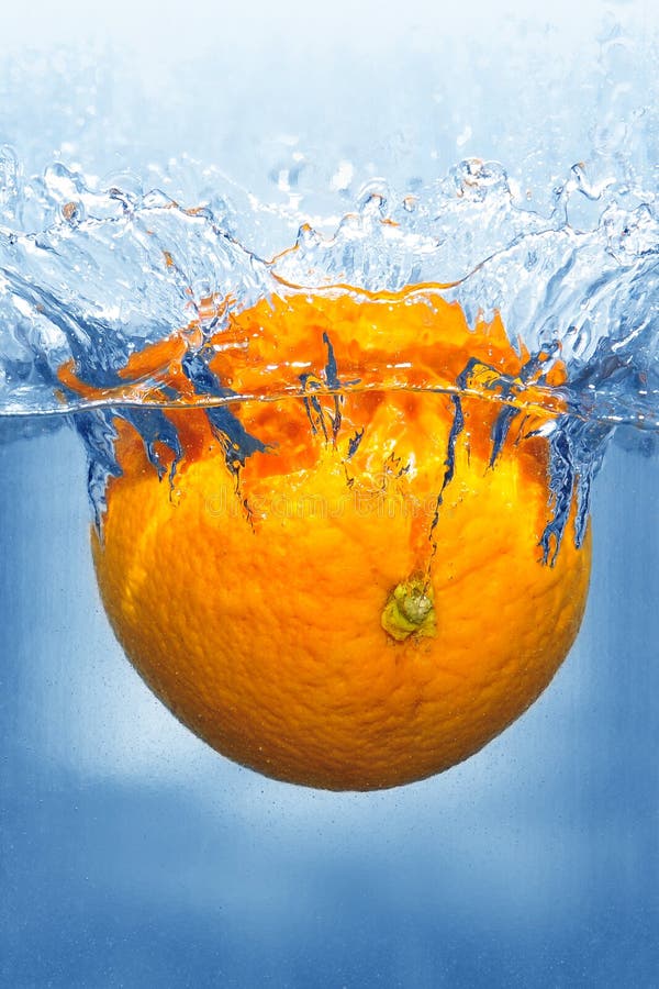 Splashing Orange into a Water with Cosmetic Tube Stock Photo Image of