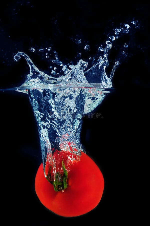 Splashing tomato into a water