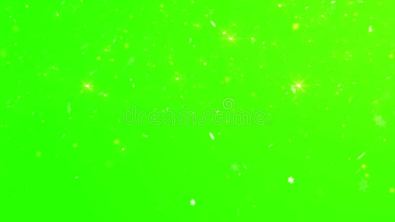 Splendida neve invernale astratta e brillantante d'oro sullo sfondo verde con fiocchi di neve in caduta e brillantini sfocati che