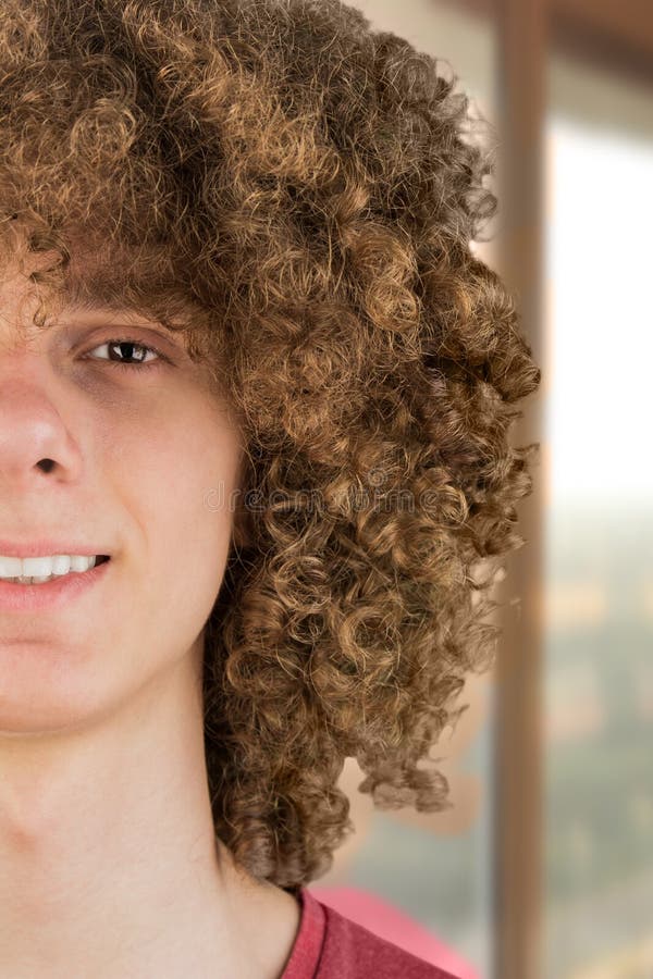 Split in Half Cropped Portrait of a Young Curly European Man with Long Curly Hair and a Dreamy Smile Close-up Against the Window. Stock Photo - Image of hairstyle, curly: 216329622 Split in Half Cropped Portrait of a Young Curly European Man with Long Curly Hair and a Dreamy Smile Close-up Against the Window. Stock Photo - Image of hairstyle, curly: 216329622