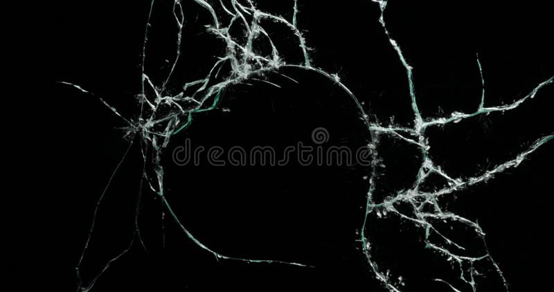 Broken cracks glass fracture effect texture isolated abstract black background. Bullet cracked window with big hole screen mirror weapon shot. Broken cracks glass fracture effect texture isolated abstract black background. Bullet cracked window with big hole screen mirror weapon shot.