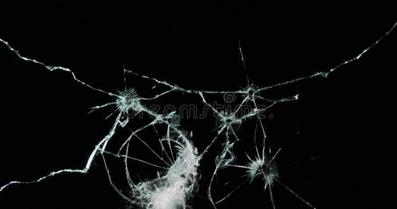 Broken cracks glass fracture effect texture isolated abstract black background. Bullet cracked window with big hole screen mirror weapon shot. Broken cracks glass fracture effect texture isolated abstract black background. Bullet cracked window with big hole screen mirror weapon shot.