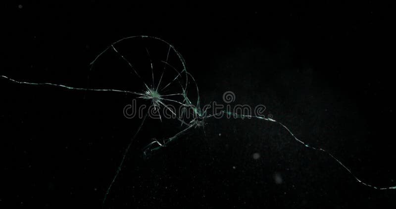 Broken cracks glass fracture effect texture isolated abstract black background. Bullet cracked window with big hole screen mirror weapon shot. Broken cracks glass fracture effect texture isolated abstract black background. Bullet cracked window with big hole screen mirror weapon shot.