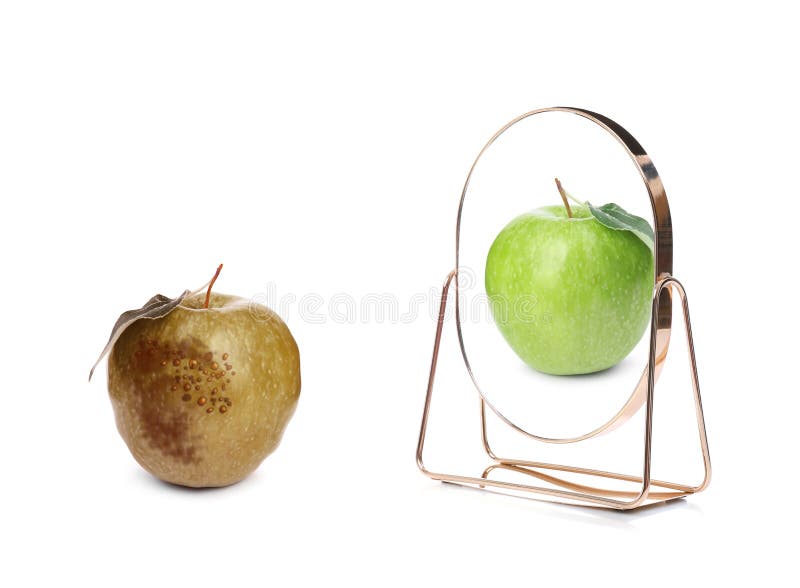 Spoiled apple and mirror with reflection on background royalty free stock photography Spoiled apple and mirror with reflection on background royalty free stock photography