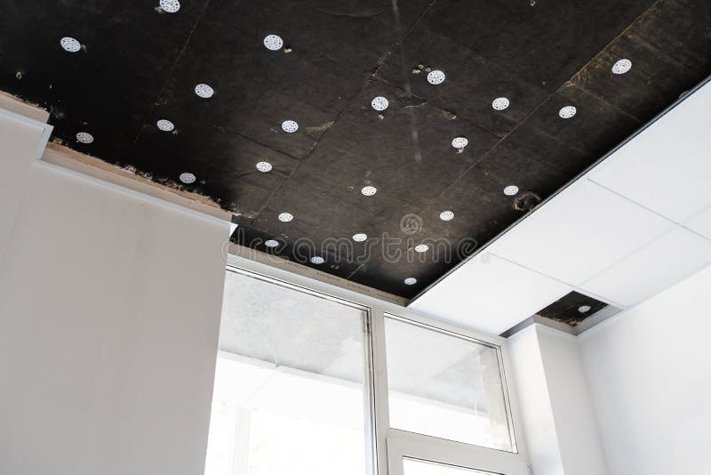 Spoiled ceiling armstrong. To flow in the roof. Disassembled ceiling royalty free stock photos
