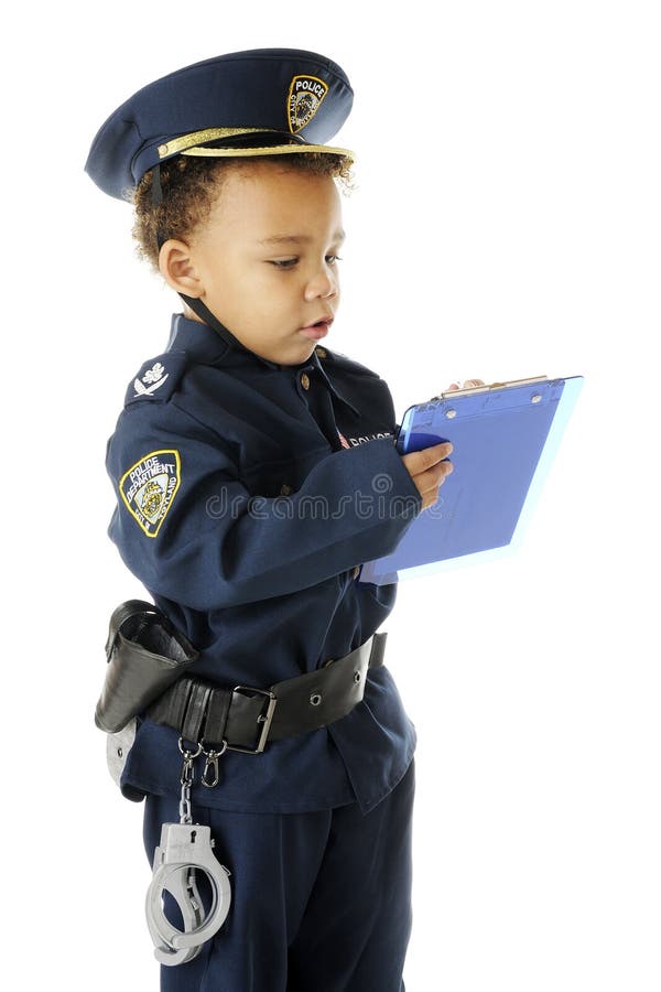 An adorable preschool police officer in full uniform writing a ticket. On a white background. An adorable preschool police officer in full uniform writing a ticket. On a white background.