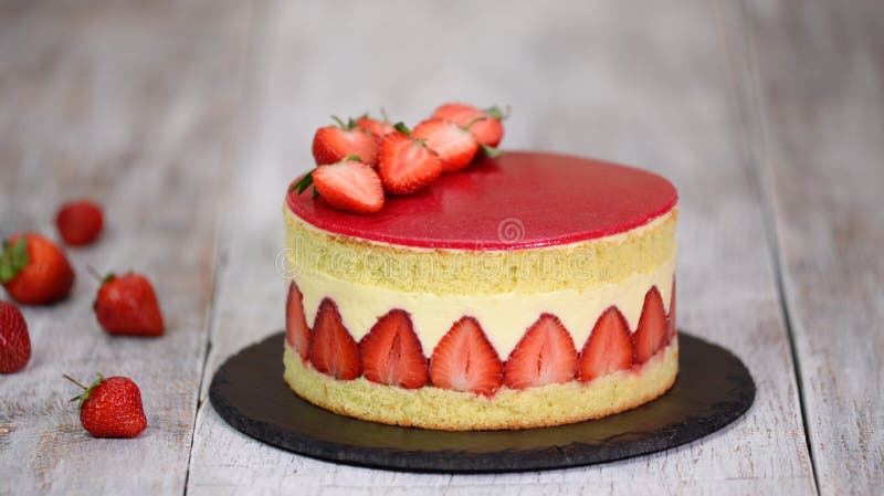 Sponge cake with strawberries and vanilla cream. Strawberry Fraisier cake royalty free stock photos Sponge cake with strawberries and vanilla cream. Strawberry Fraisier cake royalty free stock photos