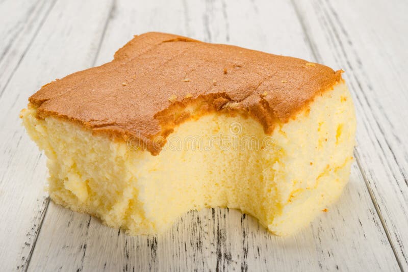 Sponge cake on white wood background