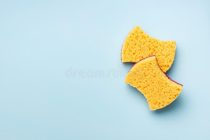 Sponges for washing dishes on blue background. Top view stock photo