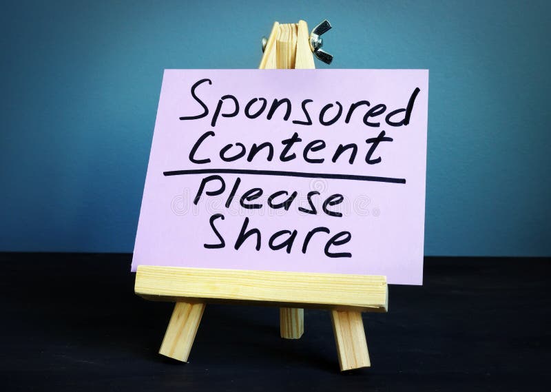 Sponsored content please share, written on a piece of paper stock image Sponsored content please share, written on a piece of paper stock image