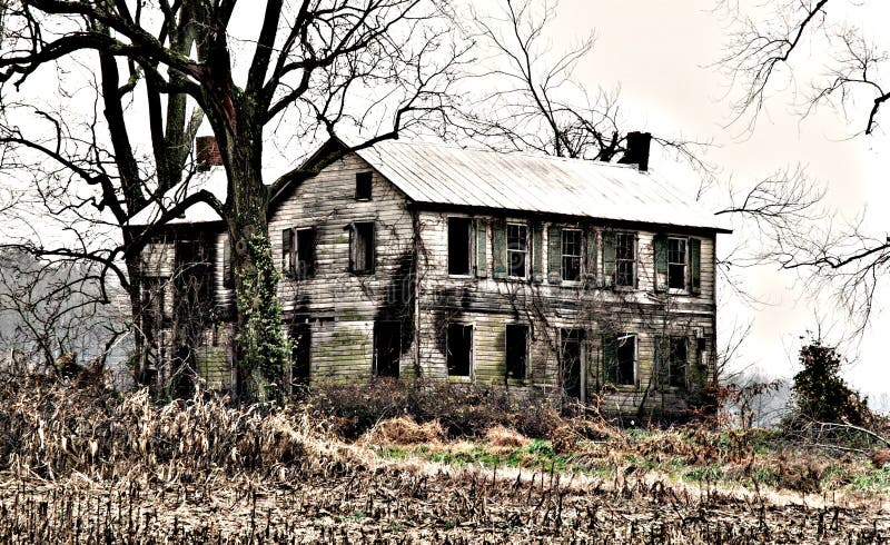 Spooky abandoned house along roadway
