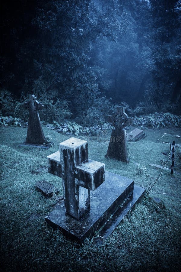 Spooky Halloween graveyard in fog
