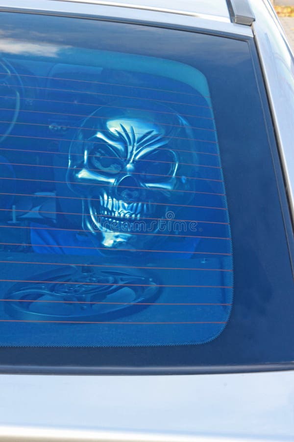 Spooky Halloween skull mask in a car royalty free stock images Spooky Halloween skull mask in a car royalty free stock images