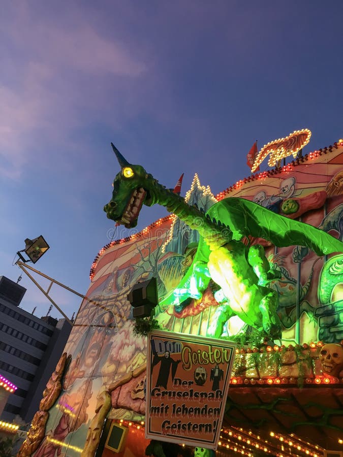 Spooky Horned Green Dragon with yellow glowing eyes - Ghost Train Puppet/Animatronic on German Funfair Hamburger Dom